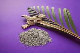 Purple background palm leaf, cross made of palm and ashes